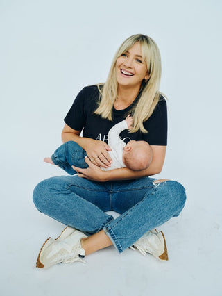 Mum reviewing a wearable breast pump