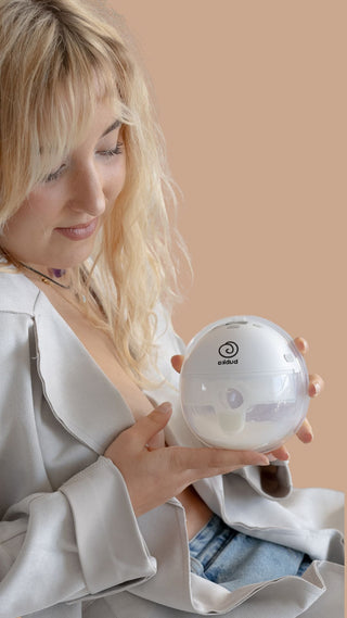 A mum testing a discreet wearable breast pump for a review.